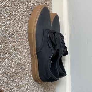 Black Vans skater shoes
